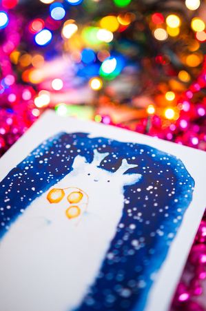 Christmas card on bright bokeh backgroundの写真素材