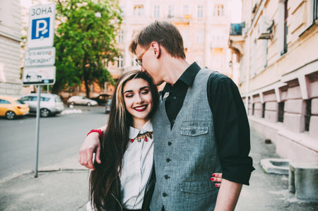 couple walking while holding handsの写真素材