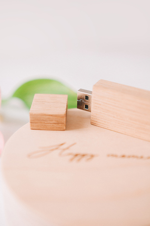 wooden box and flash drive on a white backgroundの写真素材