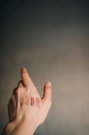 swatch liquid highlight cosmetic on hand bakgroundの写真素材