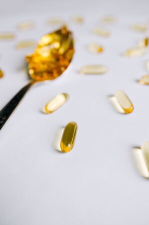 Fish oil, omega 3 capsules on a light background. Health