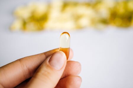 Fish oil, omega 3 capsules on a light background. Health