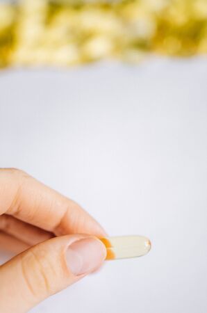 Fish oil, omega 3 capsules on a light background. Healthの写真素材