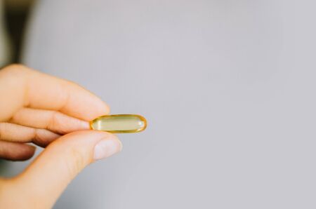 Fish oil, omega 3 capsules on a light background. Health