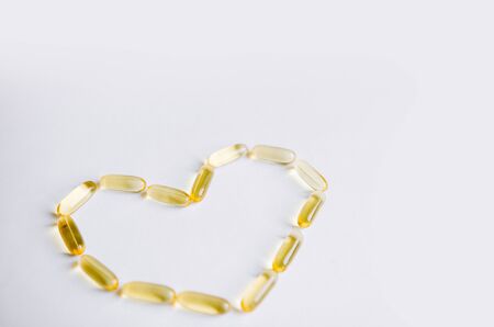Fish oil, omega 3 capsules on a light background. Health