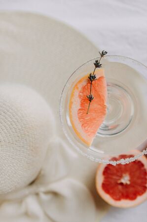 Fresh sliced grapefruit on a light backgroundの写真素材