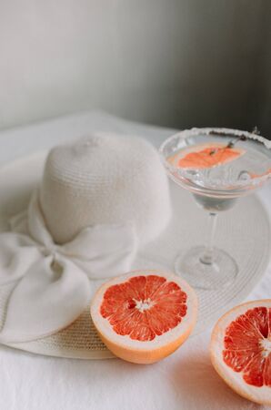 Fresh sliced grapefruit on a light backgroundの写真素材