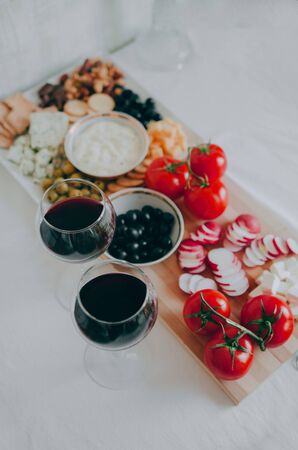 Nuts, cheese, olives, olives and other snacks.の写真素材