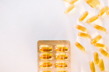 Omega 3 Fish Oil Supplement Capsules Isolated on a White Background macro.の写真素材