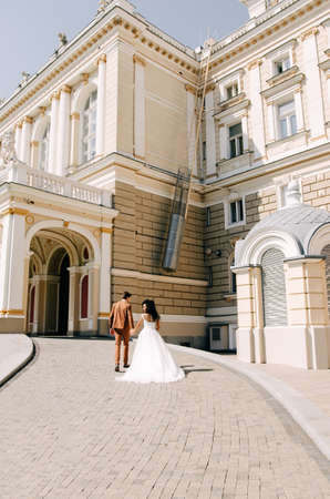 Beautiful African American girl in white dress with her husbandの写真素材