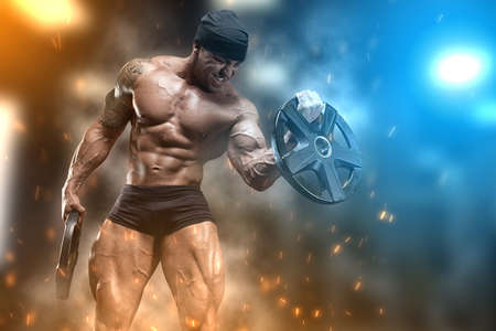 Angry athlete trains in the gymの写真素材