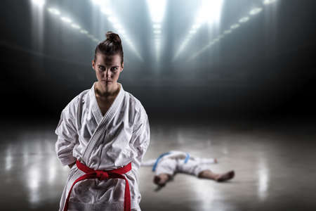 Sexy girl in a kimono karate enjoys heavy victory over a strong opponentの写真素材