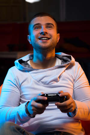 Young gamer playing video game