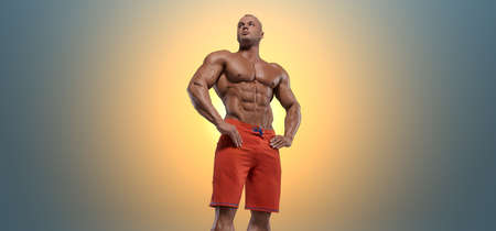 Muscular bodybuilder guy doing exercises with dumbbell over blue background