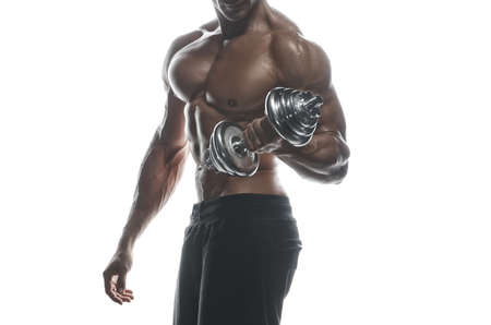 Fitness model Man posing in the studio. White background. Isolated.の写真素材