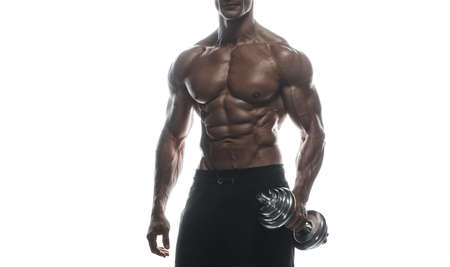 Fitness model Man posing in the studio. White background. Isolated.の写真素材