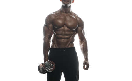 Fitness model Man posing in the studio. White background. Isolated.の写真素材