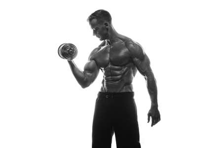 Fitness model Man posing in the studio. White background. Isolated.の写真素材