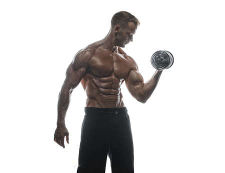 Fitness model Man posing in the studio. White background. Isolated.の写真素材