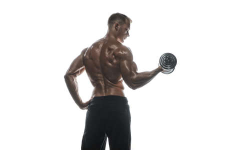 Fitness model Man posing in the studio. White background. Isolated.の写真素材
