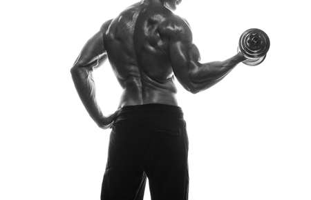 Fitness model Man posing in the studio. White background. Isolated.の写真素材