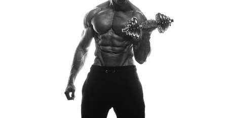Fitness model Man posing in the studio. White background. Isolated.の写真素材