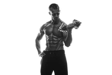 Fitness model Man posing in the studio. White background. Isolated.の写真素材