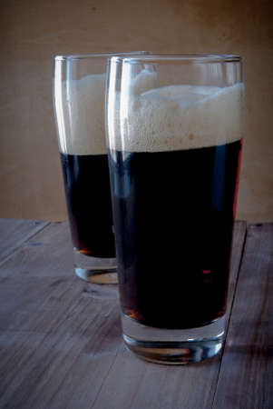 Glasses with kvass - flavored drink, reminiscent in taste non-alcoholic beer. On a wooden...