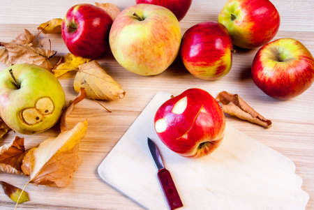 Making creepy and funny monsters of apples for the children's party on Halloween.の写真素材