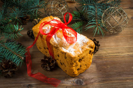 Traditional Christmas cake with raisins and powdered sugar.の写真素材