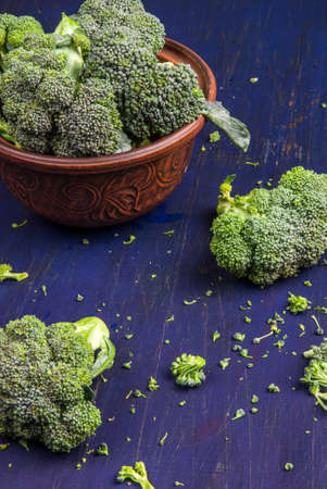 Fresh raw broccoli on a wooden tableの写真素材