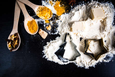 Ingredients for ginger biscuits, Christmas baking, and baking to the day of Thanksgiving: ginger, cinnamon, cardamom, citrus peel, anise. Top view, copy spaceの写真素材