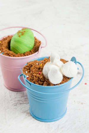 Funny baby food for easter, decorating table. Dessert of chocolate cookies in colored decorative...