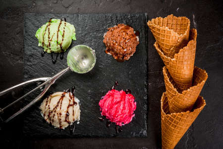 Selection of colorful home made ice cream: lemon (pistachio) green, berry pink, chocolate, white...