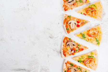 Slices of two kinds of dietary vegetarian pizza on a white stone table: with mushrooms and shrimps. Top view copy spaceの写真素材