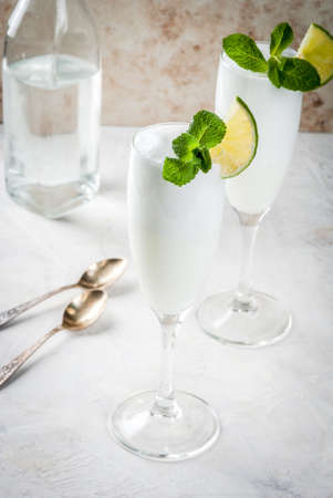 Italian summer alcoholic cocktail Sgroppino  - from ice cream, vodka and wine. Two servings in glasses. On a light background. Copy spaceの写真素材