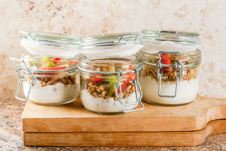 Healthy breakfast. Diet. Overnight oatmeal in a can, muesli. Yogurt with homemade granola and...