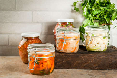 Concept of a fermented meal. Home canned food and billets. Vegan food. Vegetables. Cans of canned...