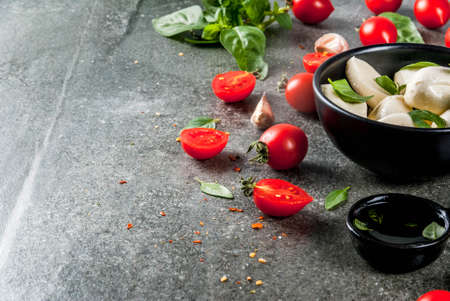 Farm raw organic products. Cooking of dinner in Italian style. Ingredients for caprese salad, pasta,...