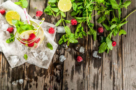 Summer drinks, cocktails. Vegan food. Infused detox water with lime, mint and fresh organic...