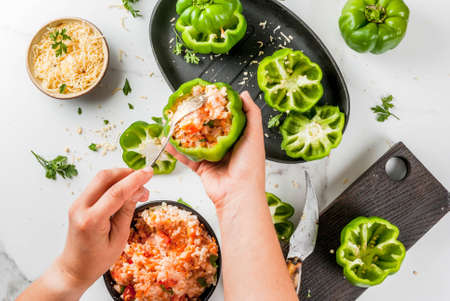 Autumn recipes. Home stuffed bell pepper with minced meat, carrots, tomatoes, herbs and cheese....