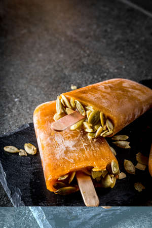 Ideas for autumn dishes from pumpkins. Treats for a Thanksgiving party, Halloween. Pumpkin ice cream...
