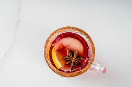 Traditional fall and winter drinks and cocktails. Red autumn hot spicy sangria with anise, cinnamon,...