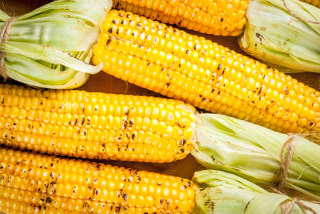 Autumn bbq, Grilled corn on white marble table, top view copy spaceの写真素材