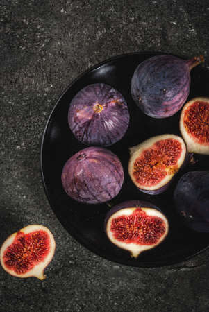 Raw fresh figs on dark stone background, copy space top viewの写真素材