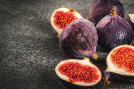 Raw fresh figs on dark stone background, copy spaceの写真素材