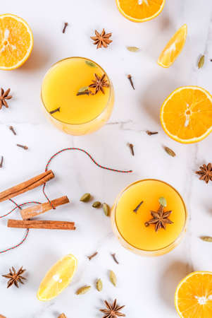 Fall, winter cocktails, Hot and spicy winter orange punch with cinnamon, anise stars, cardamom,...