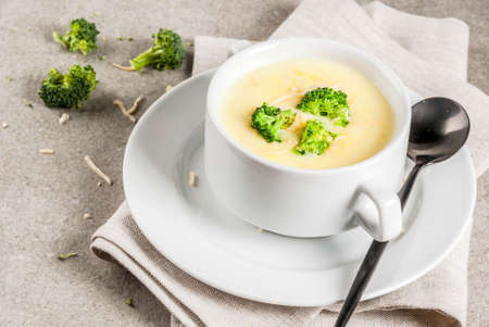 Broccoli, cheese and chicken soup, on gray stone table, copy spaceの写真素材