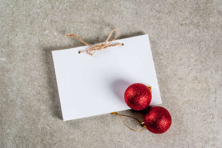 Christmas background, notepad with xmas tree balls. gray stone background, copy spaceの写真素材