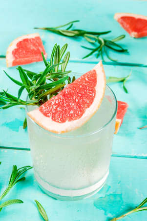 Alcohol drink, Rosemary, Grapefruit & Gin Cocktail, On light blue wooden table background, copy spaceの写真素材
